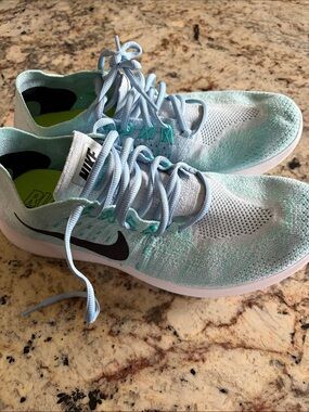 Nike Women’s Light Blue and Mint Flyknit Running Sneakers